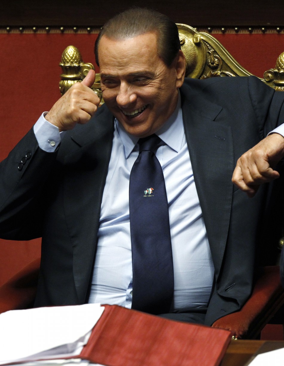 Italian Prime Minister Silvio Berlusconi gives thumbs-up at the Senate in Rome