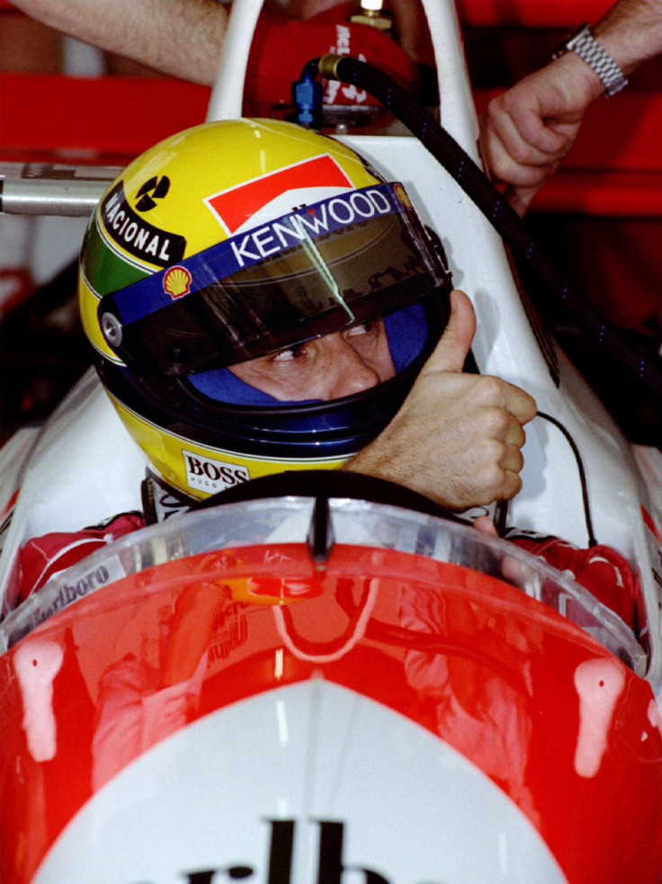 Former World Champion Brazilian Ayrton Senna gives the thumbs up to his pit crew after completing th..