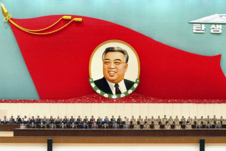 North Korean officials attend a national meeting to commemorate the 98th birth anniversary of North Korean founder and the late leader Kim Il-sung