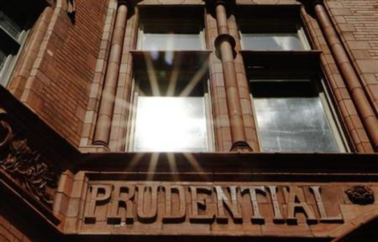 The sun reflects in a window above the raised lettering of the former Prudential Assurance building in the City of London