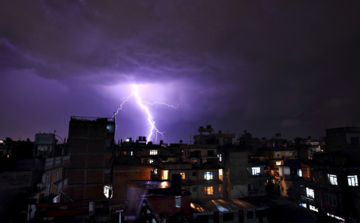 Lightning strikes over buildings during a thunderstorm in Kathmandu