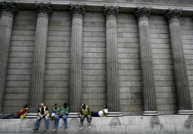 Construction workers sit amongst the columns of the Bank of England in central London