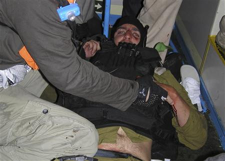 Pro-Palestinian activists hold down an Israeli commando on the Gaza-bound Turkish ship Mavi Marmara Pro-Palestinian activists hold down an Israeli commando on the Gaza-bound Turkish ship Mavi Marmara