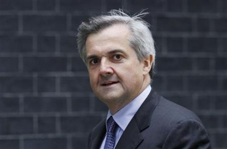 Energy and Climate Change Secretary Huhne arrives at the 10 Downing Street official residence of Prime Minister Cameron in London
