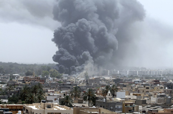 Smoke rises after coalition air strikes in Tripoli
