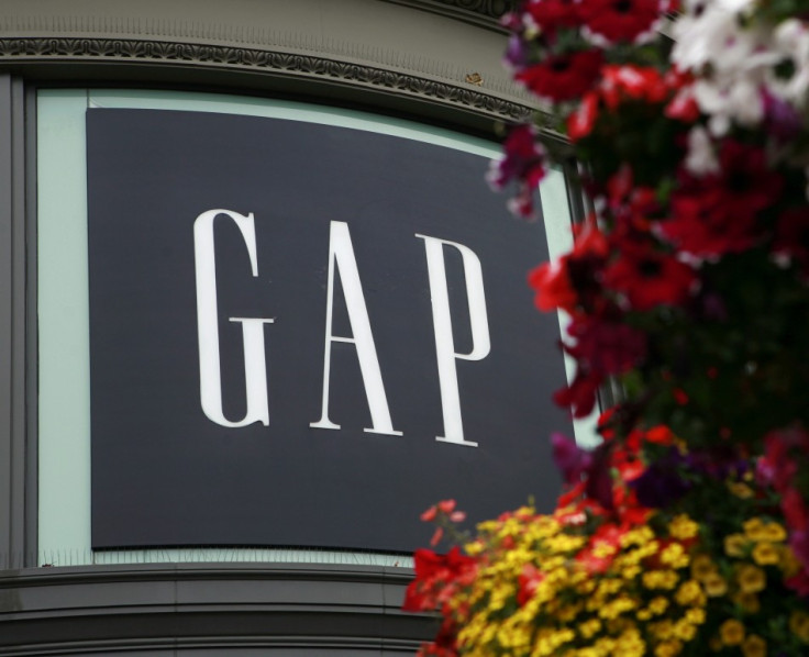 A basket of flowers hangs near Gap Inc&#039;s flagship retail store at the Powell Street cable car turn in San Francisco