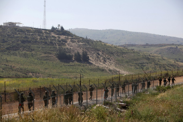 Israeli soldiers patrol along the Israeli-Syrian border near Majdal Shams in the Golan Heights