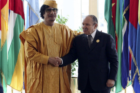 Libyan leader Gaddafi greets Algeria's President Bouteflika before opening of the African Union summit in Sirte