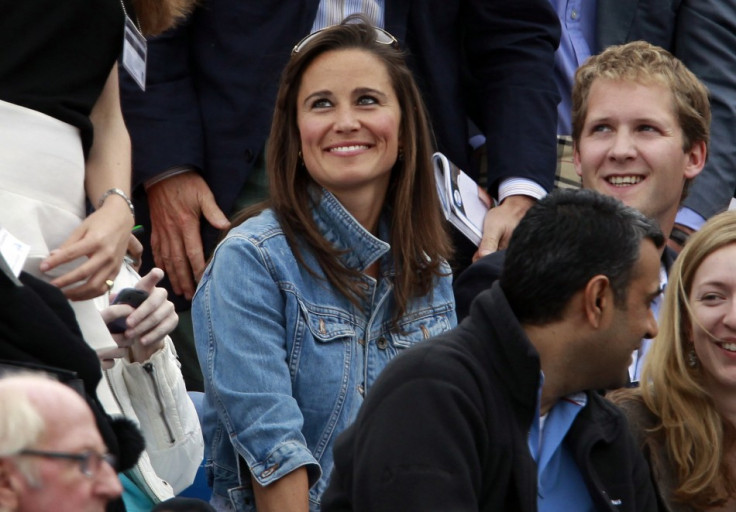 Pippa Middleton (C), sister of Catherine, Britain's Duchess of Cambridge smiles during the match between Andy Murray of Britain and Janko Tipsarevic of Serbia at the Queen's Club Championships in west London June 9, 2011.