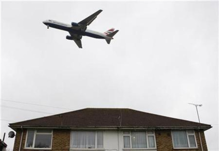 An aircraft makes its final approach before landing at Heathrow Airport in west London