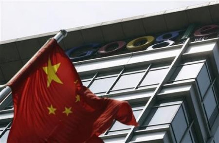 A Chinese national flag waves in front of the former headquarters of Google China in Beijing June 2, 2011.