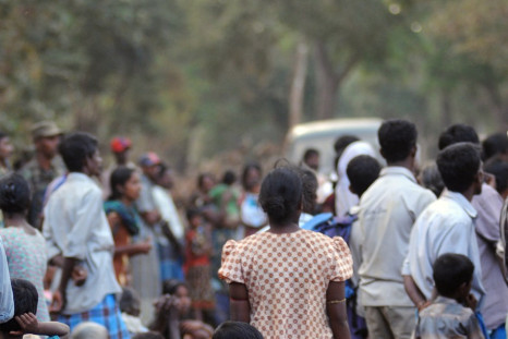Ethnic Tamil civilians wait to go to a camp for internally displaced people