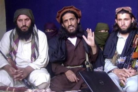 In this image taken from a video recording, Omar Khalid Khorasani (C), a top Pakistan Taliban commander, gives an interview in Pakistan's Mohmand tribal region on June 2, 2011.