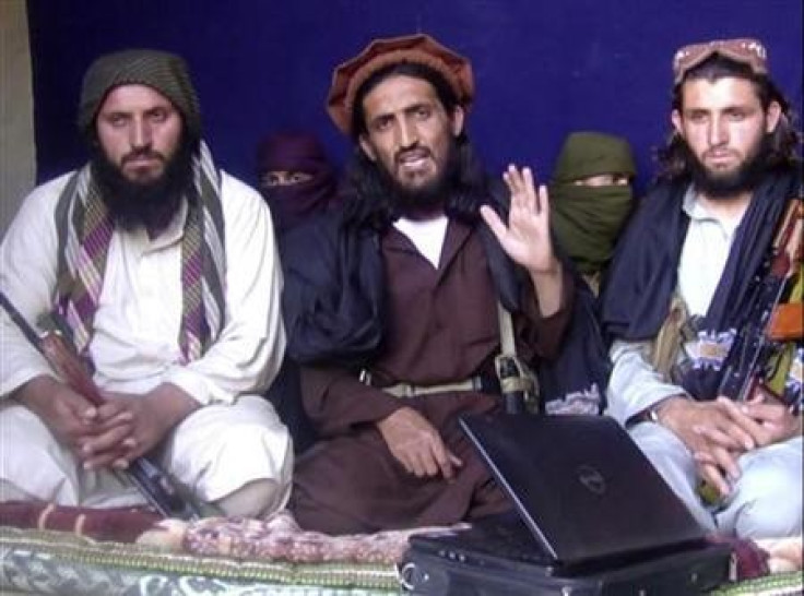 In this image taken from a video recording, Omar Khalid Khorasani (C), a top Pakistan Taliban commander, gives an interview in Pakistan&#039;s Mohmand tribal region on June 2, 2011.