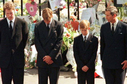Earl Spencer (L) Prince William (2nd L) , Prince Harry and Prince Charles (R) watch as the coffin of Diana, Princess of Wales is driven away in a hearse from Westminster Abbey following her funeral service September 6, 2007.