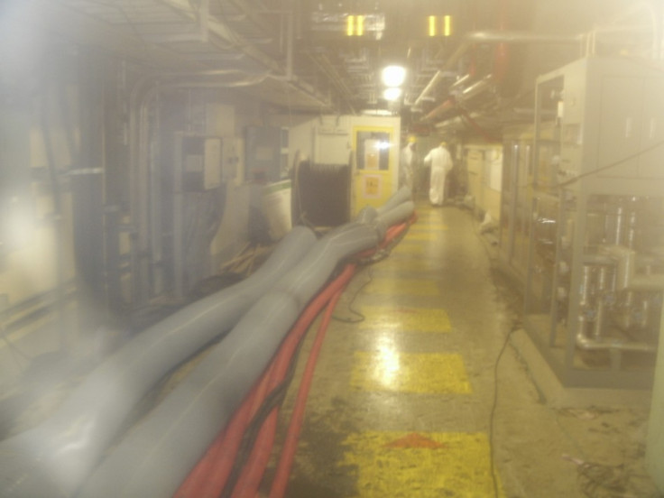 Workers walking inside Tokyo Electric Power Co.(TEPCO)&#039;s Fukushima Daiichi