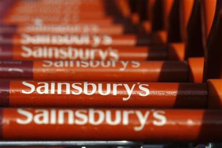 Sainsbury's shopping trolleys are lined up together outside a Sainsbury's supermarket in Brighton