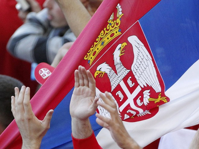 Serbia fans hold up their national flag as they celebrate after defeating Germany in 2010 World Cup Group D soccer match against Serbia in Port Elizabeth Serbia fans hold up their national flag as they celebrate after defeating Germany in 2010 World Cup Group D soccer match against Serbia in Port Elizabeth