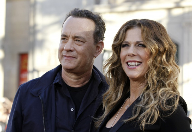 Director and cast member Tom Hanks and his wife and cast member Rita Wilson pose at the world premiere of &quot;Larry Crowne&quot; at the Chinese theatre in Hollywood
