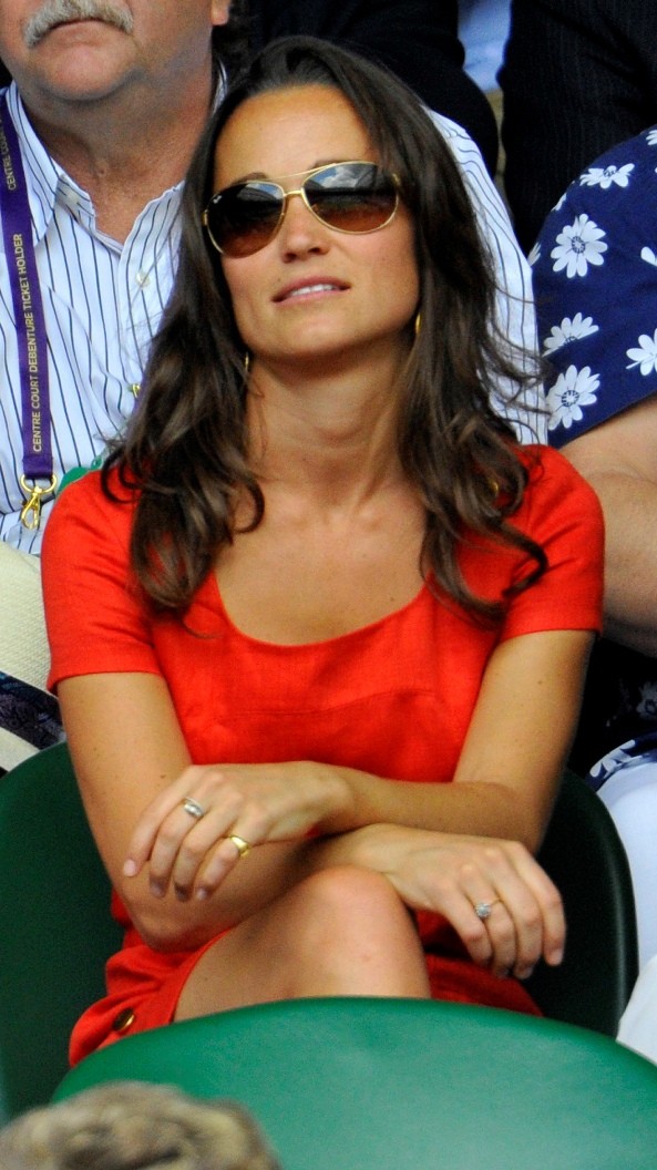 The sister of Catherine, Duchess of Cambridge, Pippa Middleton, sits on Centre Court for the quarter-final match between Jo-Wilfried Tsonga of France and Roger Federer of Switzerland at the Wimbledon tennis championships in London