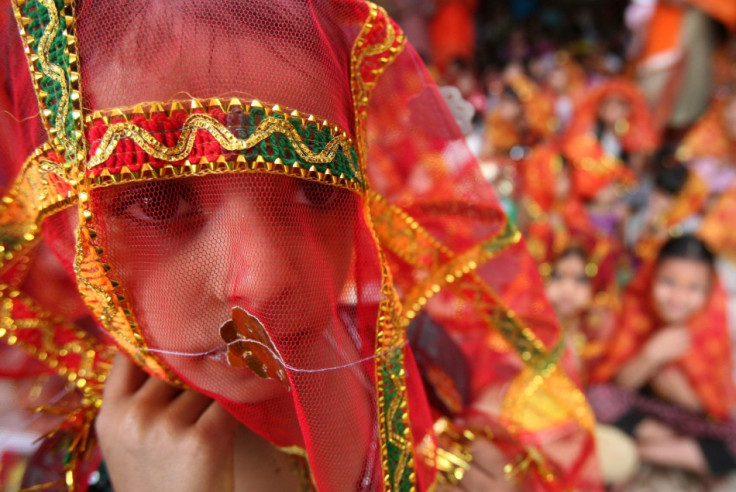 A girl attends a prayer ceremony inside a temple during celebrations to mark the &quot;Navratri&quot; festival in Chandigarh