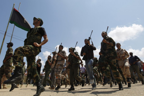 Rebel fighters march during their graduation ceremony in Benghazi