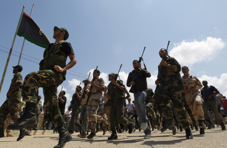 Rebel fighters march during their graduation ceremony in Benghazi