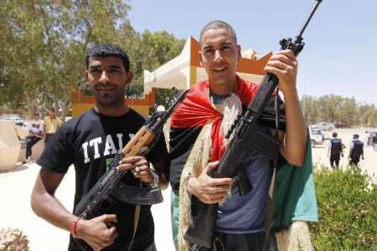 China avoids criticizing France over Libya arms