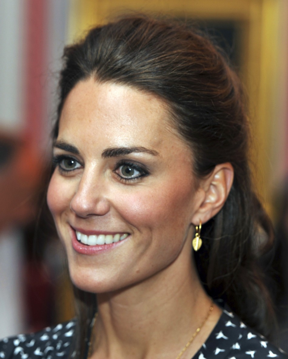 Britains Catherine, Duchess of Cambridge, smiles during an informal reception for young Canadian volunteers in Ottawa