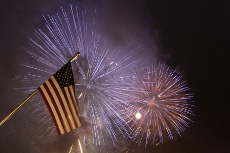 Fireworks illuminate the sky next to a U.S. national flag at the new U.S. embassy during its opening ceremony in Berlin