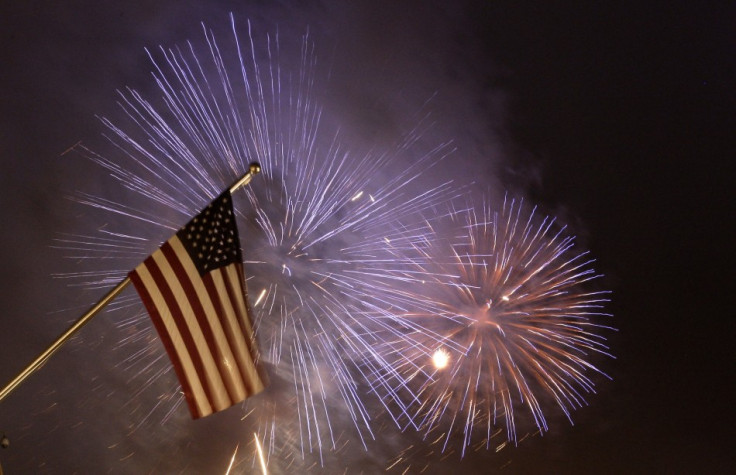 Fireworks illuminate the sky next to a U.S. national flag at the new U.S. embassy during its opening ceremony in Berlin