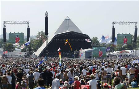 England fans watch the England soccer match against Slovenia on large screens at the Glastonbury Festival 2010 in south west England