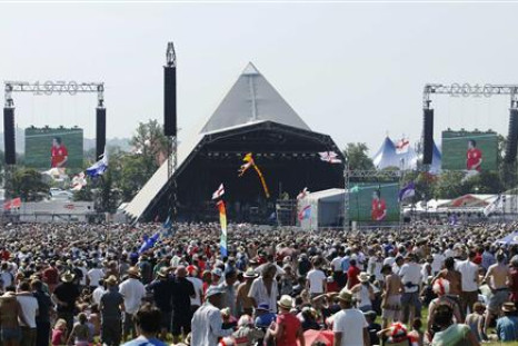 England fans watch the England soccer match against Slovenia on large screens at the Glastonbury Festival 2010 in south west England