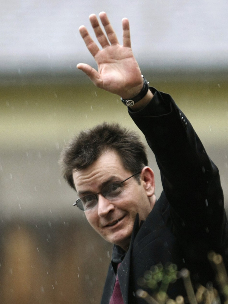 Actor Charlie Sheen gestures toward the media as he leaves the Pitkin County Courthouse after his sentencing hearing in Aspen