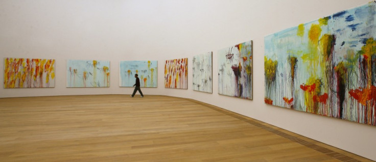 A man walks past the paintings of U.S. artist Cy Twombly in the new Museum Brandhorst modern art museum in Munich