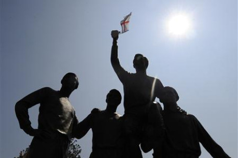 England flag flutters on the statue of soccer captain Bobby Moore and his team mates