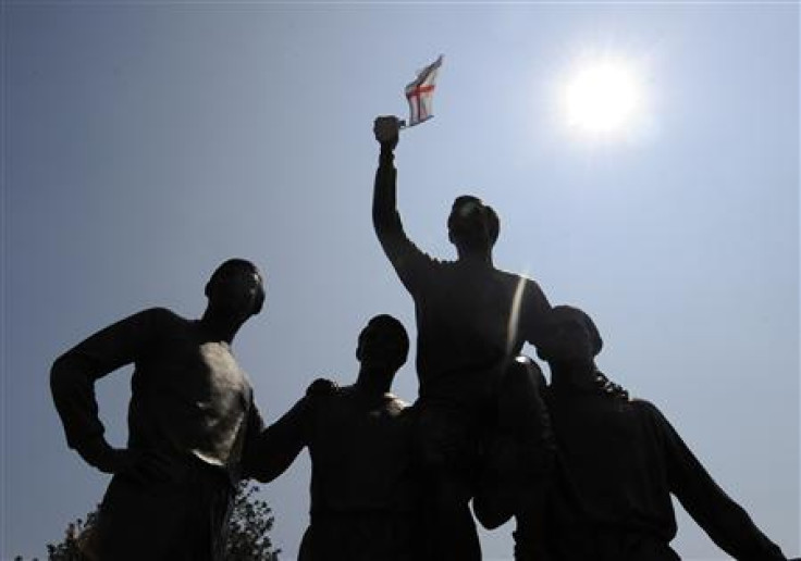 England flag flutters on the statue of soccer captain Bobby Moore and his team mates