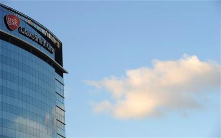 A GlaxoSmithKline logo is seen outside one of its buildings in west London, ahead of company results