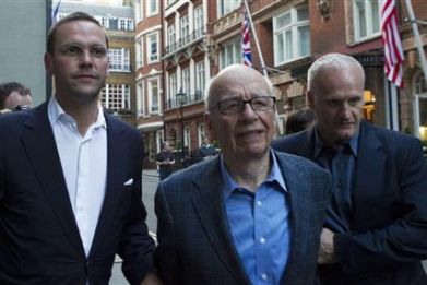 James and Rupert Murdoch and a minder leave the Stafford Hotel in St James&#039;s Place, central London
