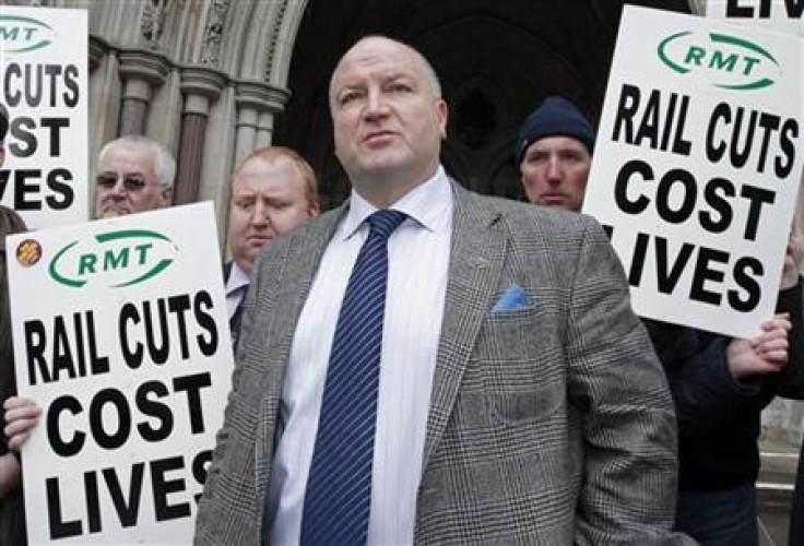 General Secretary of the National Union of Rail, Maritime and Transport Workers (RMT), Crow, speaks to the media as he leaves the High Court in London
