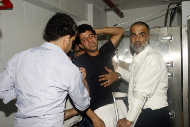 Relatives of Sarhan mourn at the hospital morgue in Nablus