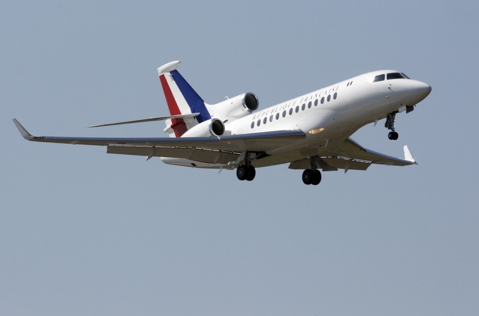 A French presidential plane, with tri-colour tail insignia, thought to carry Frances President Nicolas Sarkozy, prepares to land at the military air base of Solenzara in Corsica