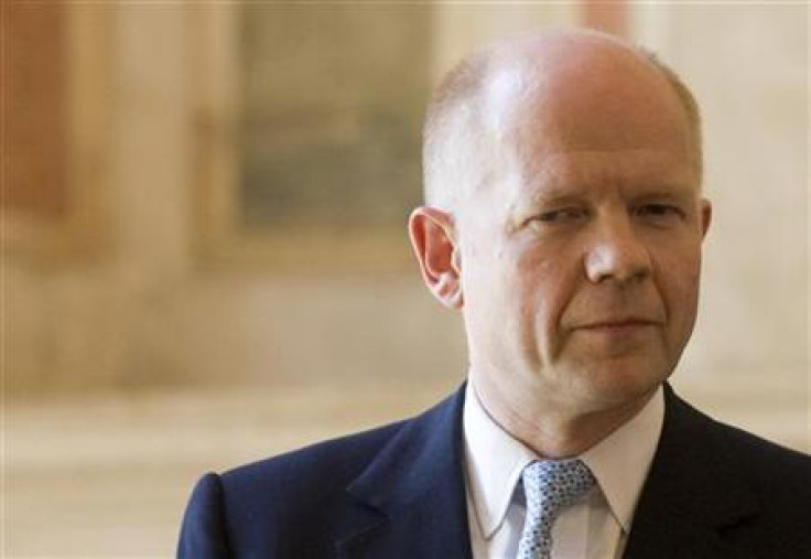 Foreign Secretary Hague looks on during a joint news conference with his Italian counterpart Frattini at the end of a meeting at Villa Madama in Rome