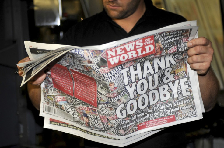 Printer Jamea Bradley looks at final copy of News of the World