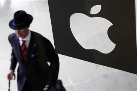 A customer enters the new Apple store, which is the world's largest, on its opening day at Covent Garden in London