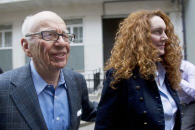 News Corporation CEO Rupert Murdoch leaves his flat with Rebekah Brooks