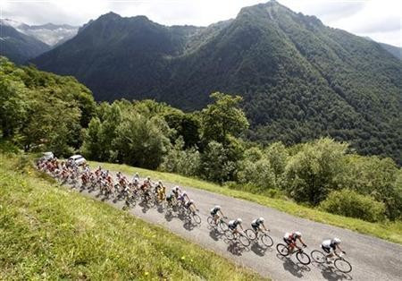 A pack of riders cycles