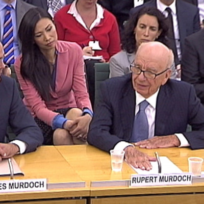 James and Rupert Murdoch appear before a parliamentary committee at Portcullis House in London