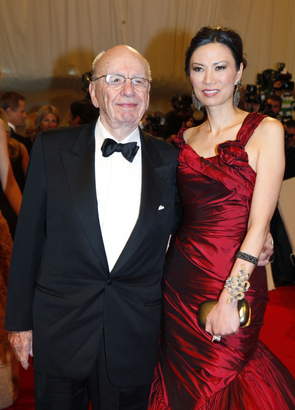 Rupert Murdoch and wife Wendi Deng Murdoch pose on the red carpet at the Metropolitan Museum of Art Costume Institute Benefit celebrating the opening of Alexander McQueen Savage Beauty in New York