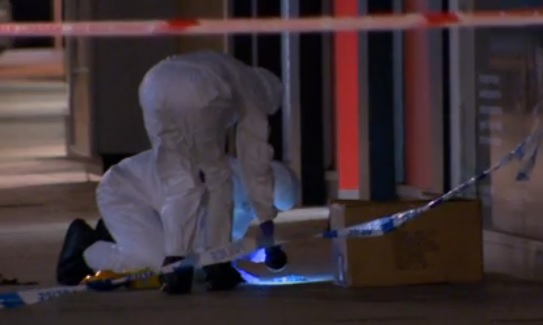 Police forensic team comb area in Cornmarket, Belfast targeted by a firebomber Police forensic team comb area in Cornmarket, Belfast targeted by a firebomber